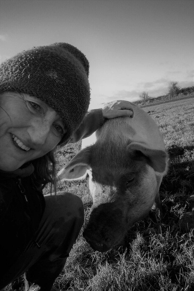 Helen Wade takes a selfie with a saddleback sow