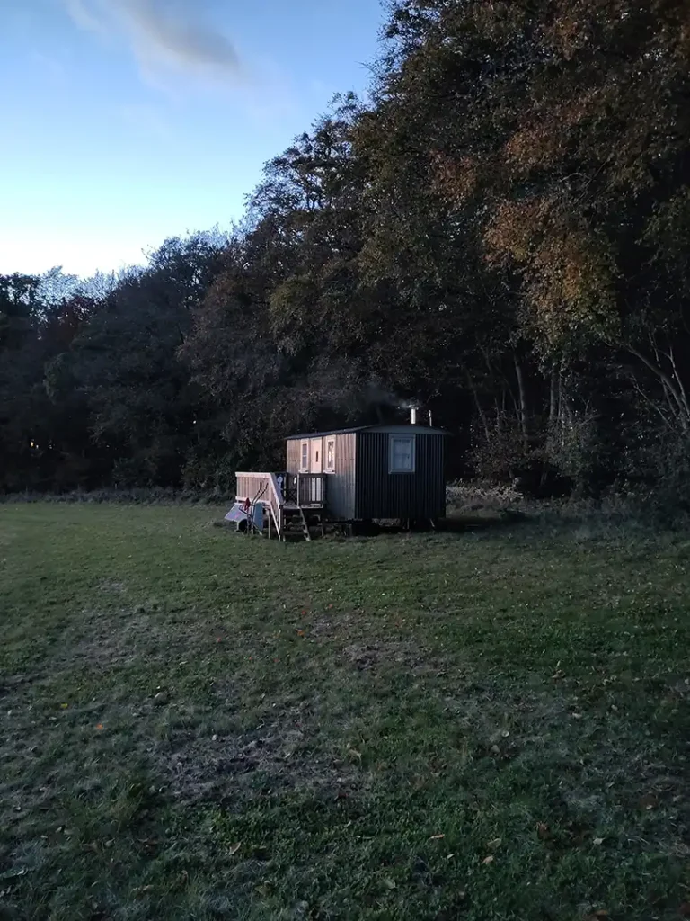 An external view of the Shepherd's hut at Eastleach Downs Organic Farm, Gloucestershire