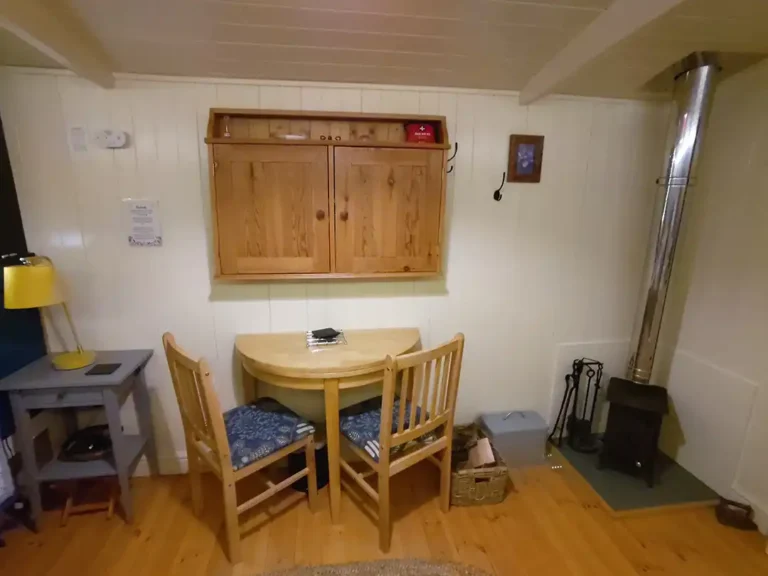 The dining area at Eastleach Downs Organic Farm Shepherd's Hut, Gloucestershire
